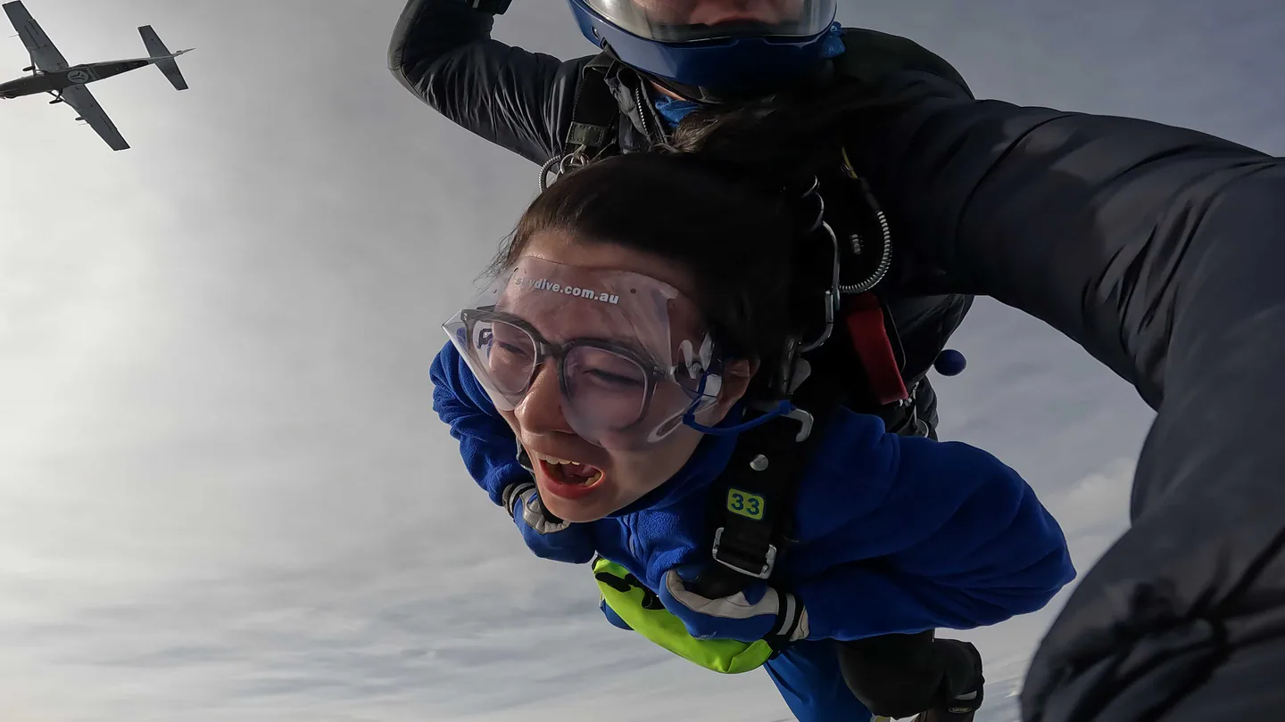 Christina skydiving with an instructor in Sydney, Australia.